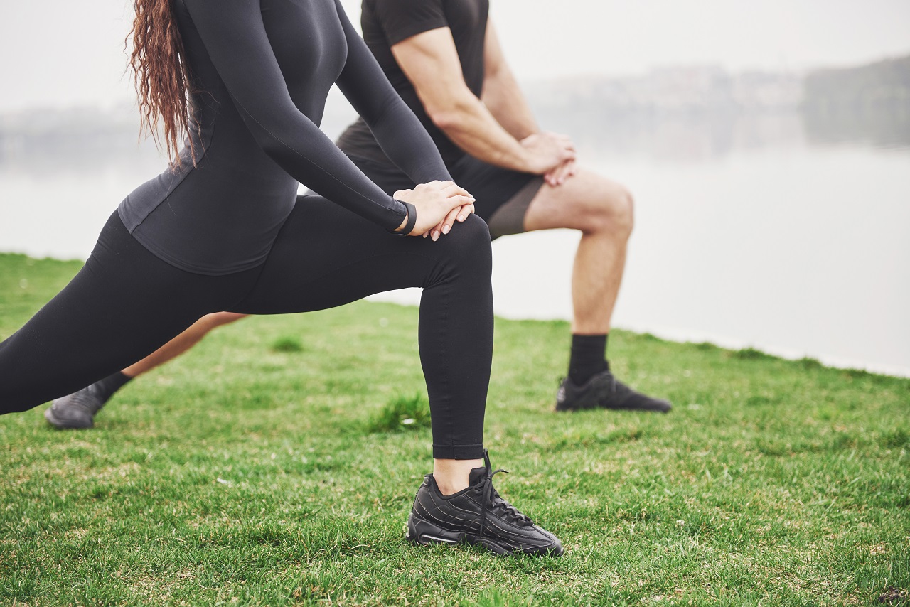 Person doing morning stretching exercise outdoors
